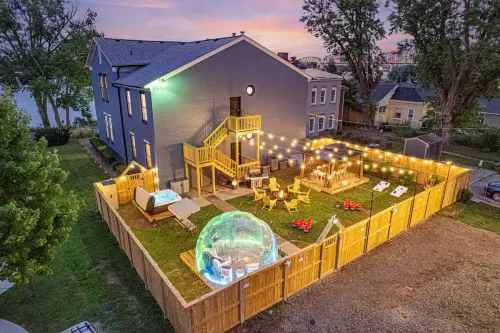 Top-of-the-line Amenities: backyard oasis with hot tub, firepit, games, BBQ; indoor exotic coffee bar and gaming zone, and front porch/ balcony with waterfront views. Something for everyone to enjoy!